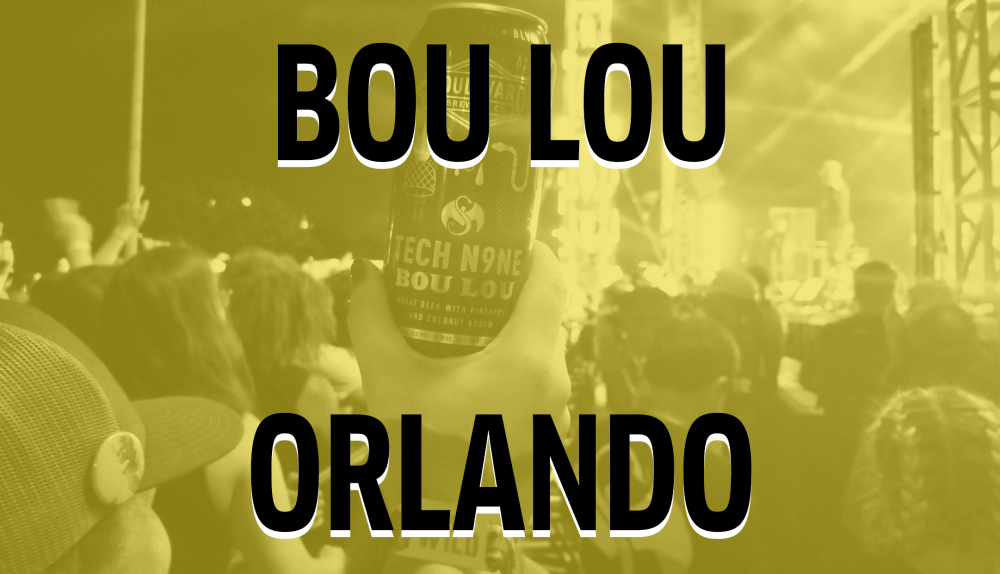 A hand holds up a can of "Tech N9ne Bou Lou" at an outdoor concert. The stage and crowd are blurred in the background. Large text overlays the image reading "BOU LOU ORLANDO." The photo has a yellow tint.