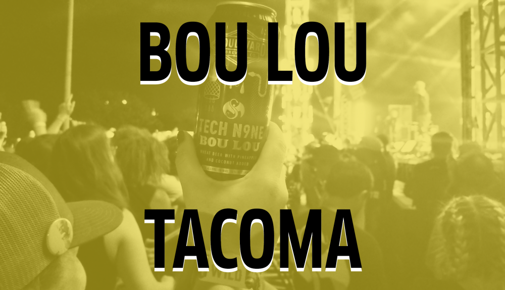 A hand holds a can labeled "Boule Lou" in the air at a concert. The scene is bathed in yellow light with a crowd and stage visible. Large text on the image reads "Bou Lou Tacoma.