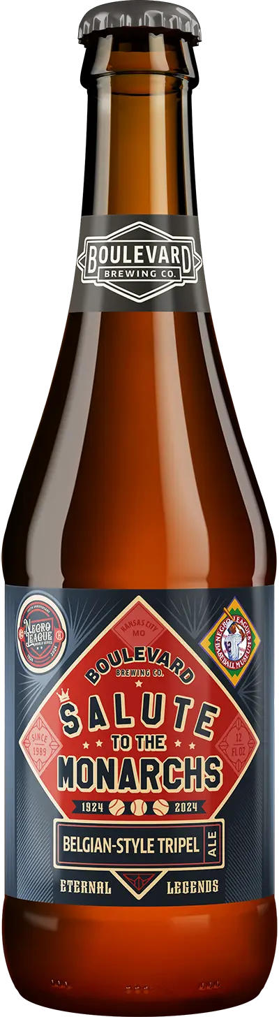 A brown glass beer bottle with a label that reads "Boulevard Brewing Co. Salute to the Monarchs" and "Belgian-Style Tripel Ale." The label features a red and blue design with baseball elements and the text "Eternal Legends" at the bottom.