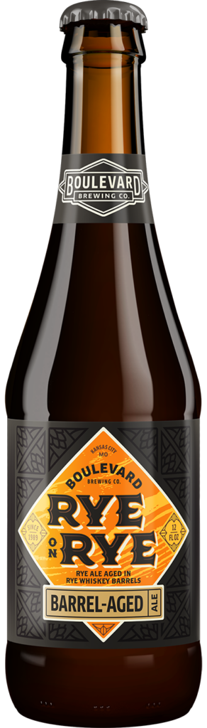 A bottle of Boulevard Brewing Co.'s Rye on Rye Barrel-Aged Ale. The dark bottle features a label with an orange diamond design and text highlighting its aging in rye whiskey barrels.