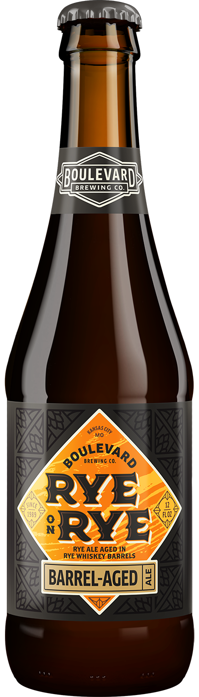 A bottle of Boulevard Brewing Co.'s Rye on Rye Barrel-Aged Ale. The dark bottle features a label with an orange diamond design and text highlighting its aging in rye whiskey barrels.