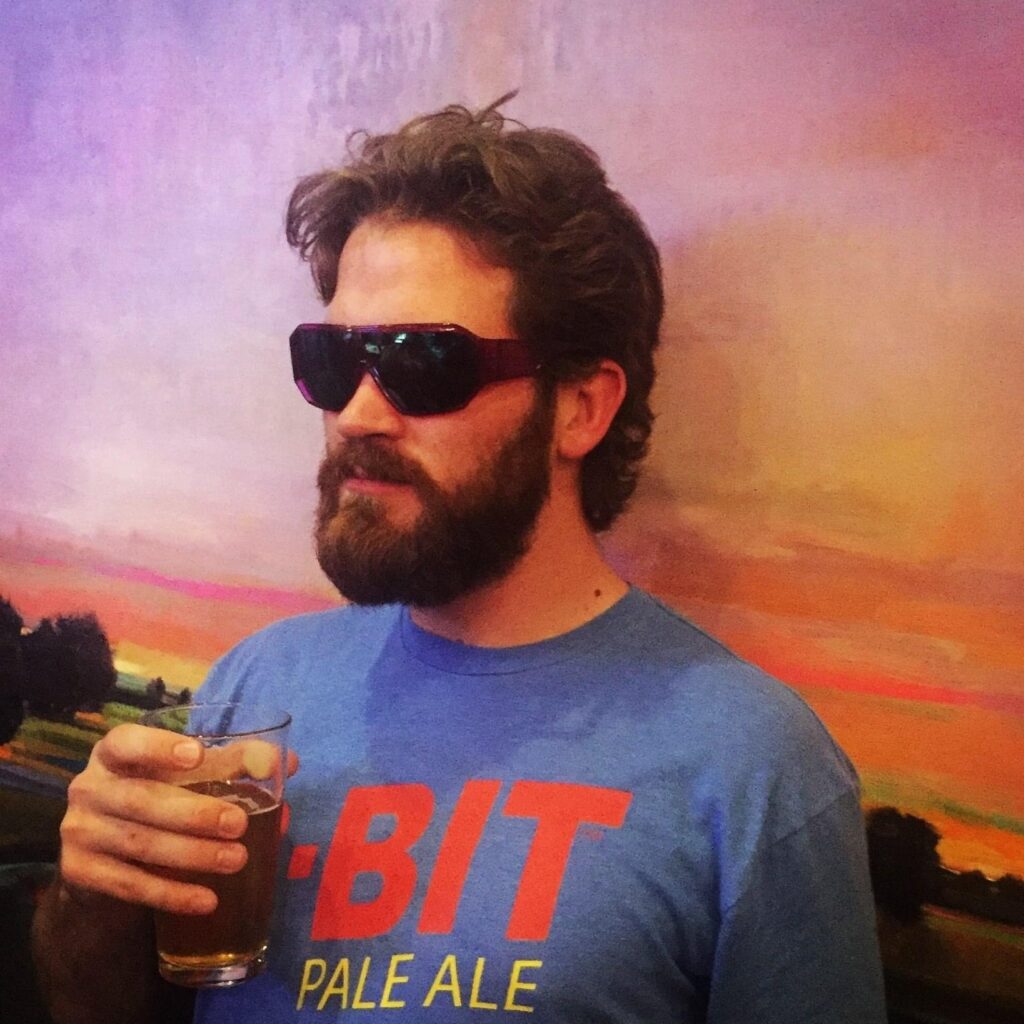 Brady with a beer and sunglasses