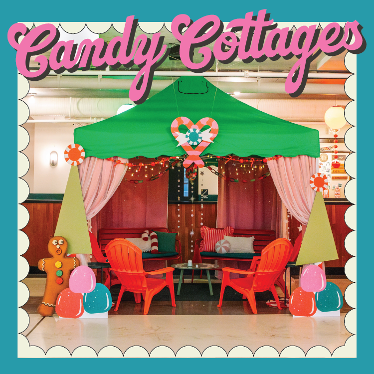 A festive indoor setup on the Rec Deck features a green tent adorned with colorful lights and candy-themed decorations. Inside are red chairs and a table. The words "Candy Cottages" are displayed at the top in pink, perfectly decking the halls with holiday cheer.